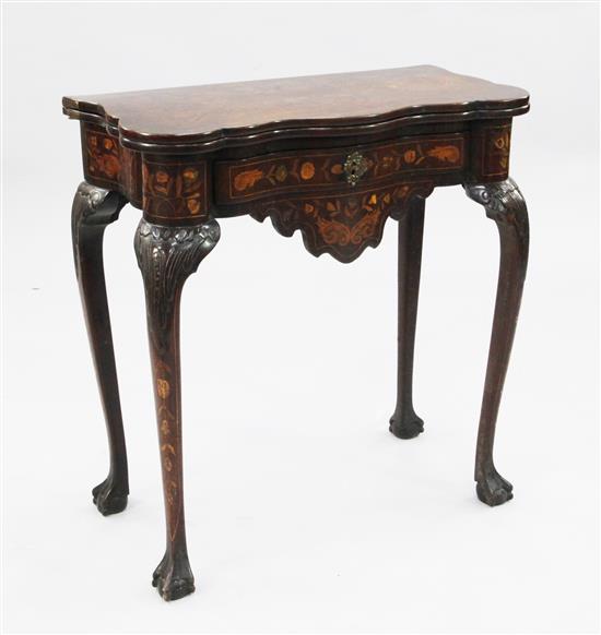 An early 19th century Dutch marquetry inlaid serpentine card table, W.2ft 4in.